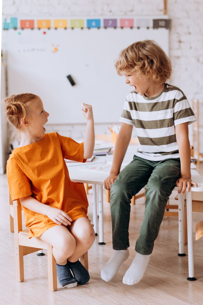 The Art of Drawing Readers In: Your attractive post title goes here Two children enjoying playful moments indoors, showcasing joy and friendship.